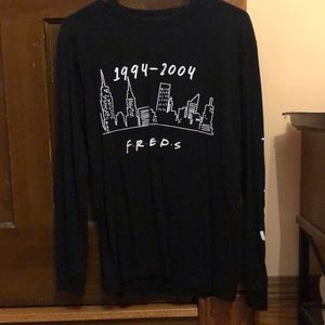 Womens size small, says Friends down the sleeve